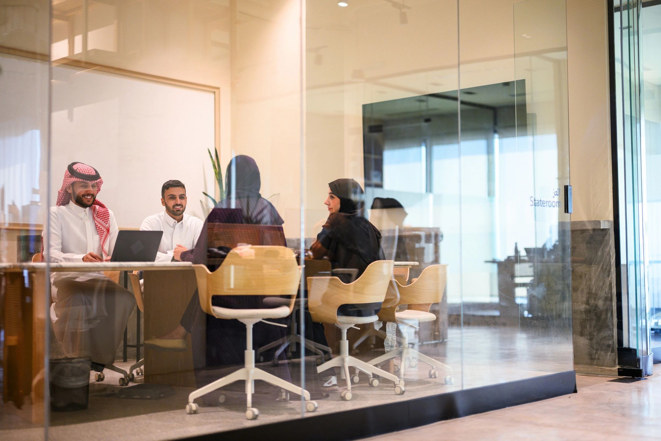 Saudi business team meeting in a modern office
